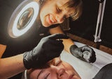 action shot of our expert esthetician doing a lash lift at Dandle Spa