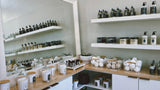 Locally made self-care products and holiday gift sets at Dandle Spa, including bath salts, candles, oils, and bath bombs