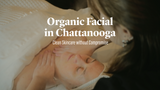 Female laying face-up on a spa table getting a facial. White text on picture says "Organic Facial in Chattanooga. Clean Skincare without compromising."