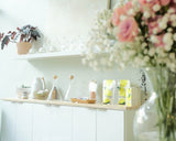 water and hot tea station on white shelving with natural wood top at an organic spa in chattanooga, TN, Dandle Spa