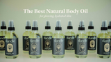 Row of dandle, handmade,  natural body oil bottles with branding and text on a light background