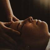 Woman getting her face massaged at Dandle Spa and Skincare in Chattanooga. Spa memberships are a good way to practice regular self-care