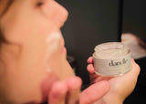 Applying Dandle clarifying cream for hydrating oil skin