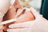 Female getting a Brow wax by licensed esthetician in Chattanooga, TN at Dandle spa