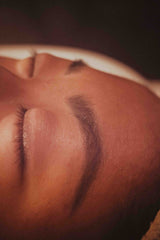Close-up of a person's face with a focus on the eye area after brow wax. Get your brows tinted or waxed at Dandle Spa