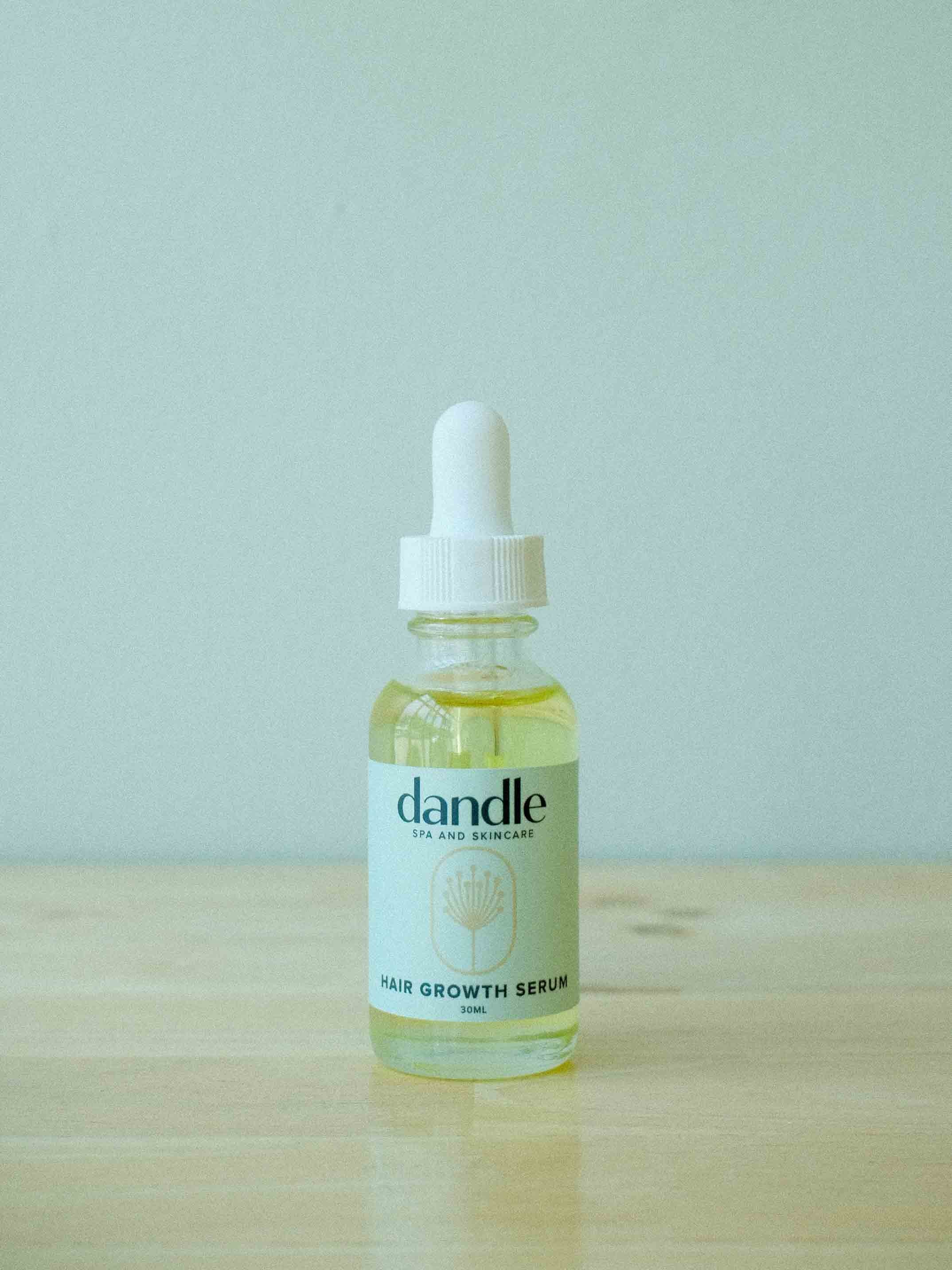 Hair Growth Serum in one ounce glass dropper made with all natural ingredients to revitalize scalp, nourish follicles and encourage hair growth.
