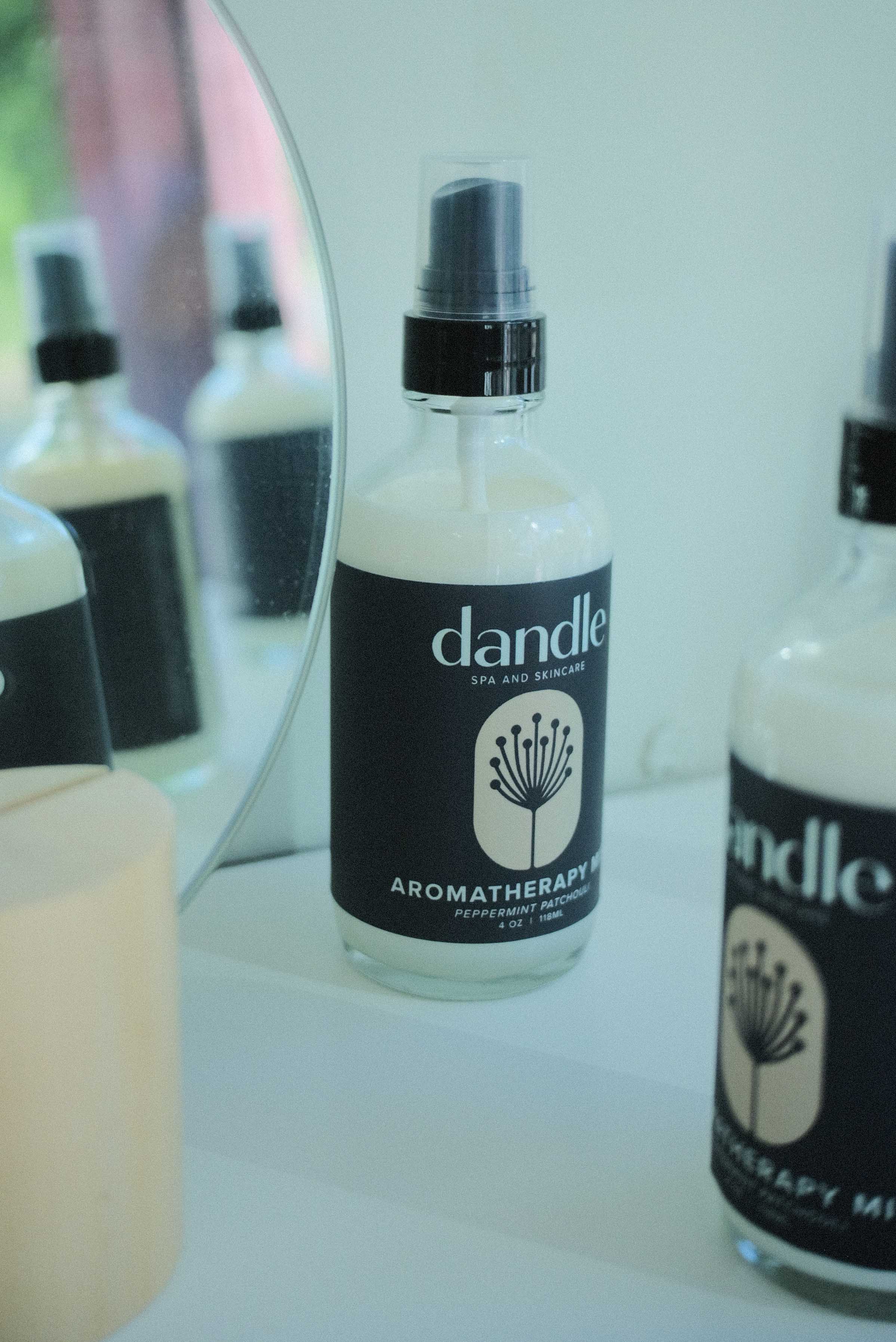 Bottle of dandle aromatherapy product on a surface with blurred background. Organic linen spray. Phalate free fragrance
