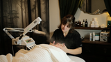 woman receiving chattanooga facial service at dandle spa