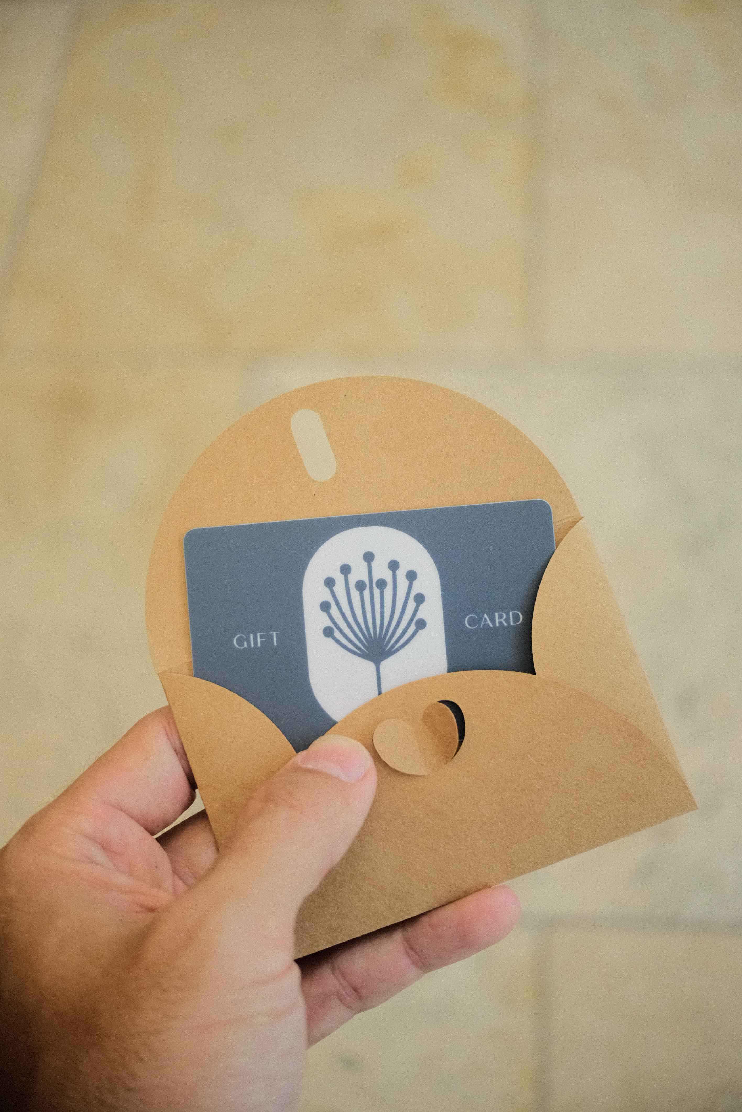 Gift card in the hands of a customer in Chattanooga Spa